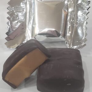 A close up of two pieces of chocolate