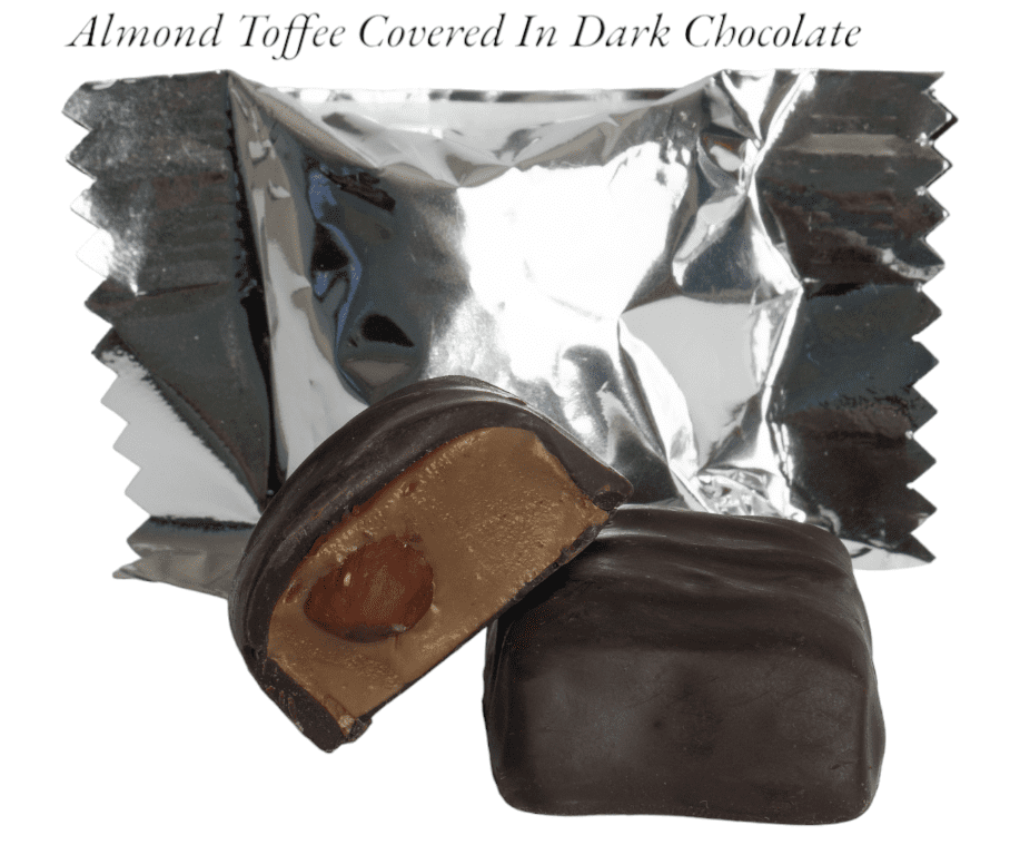 A chocolate covered almond toffee is sitting on top of foil.